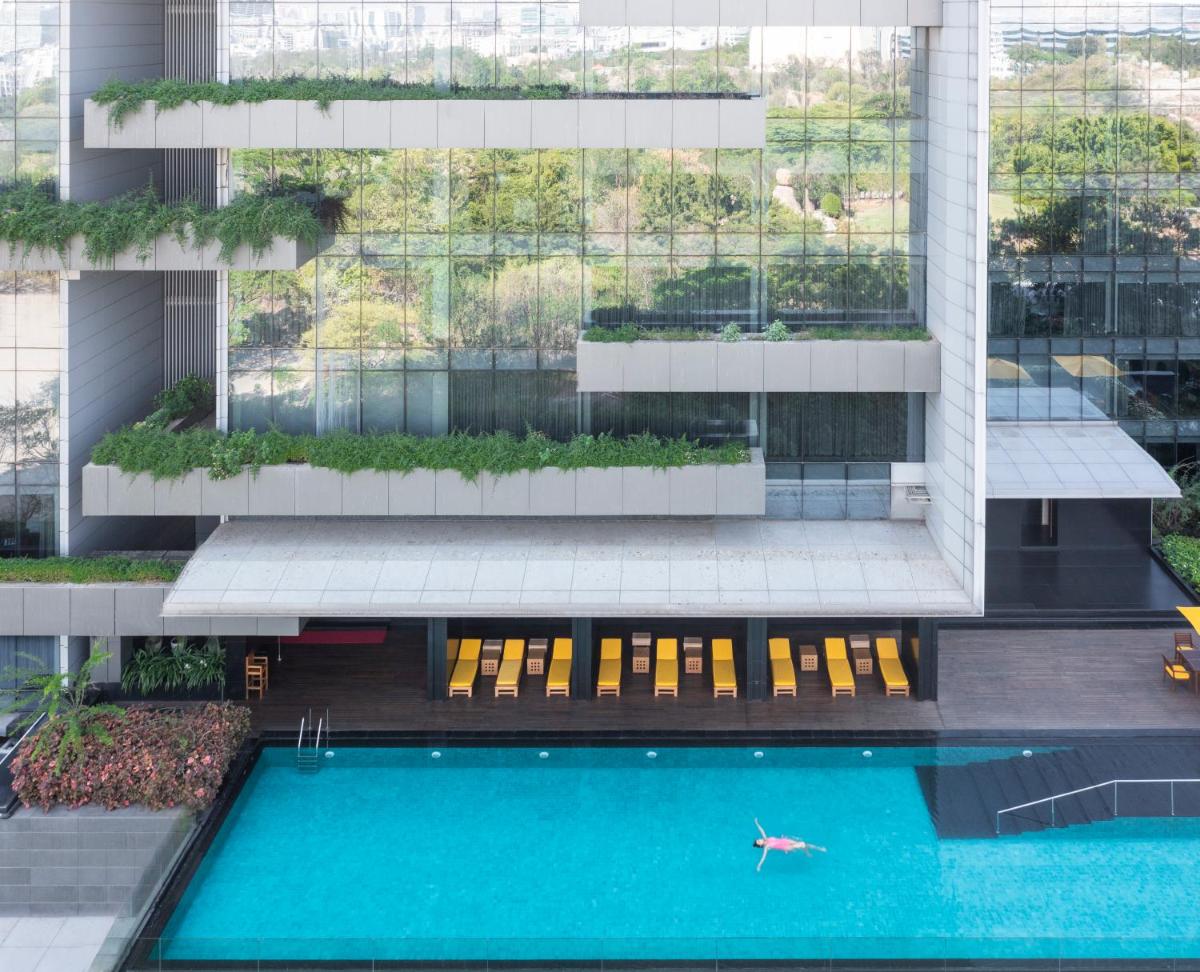 an aerial view of a building with a swimming pool at Trident Hyderabad in Hyderabad