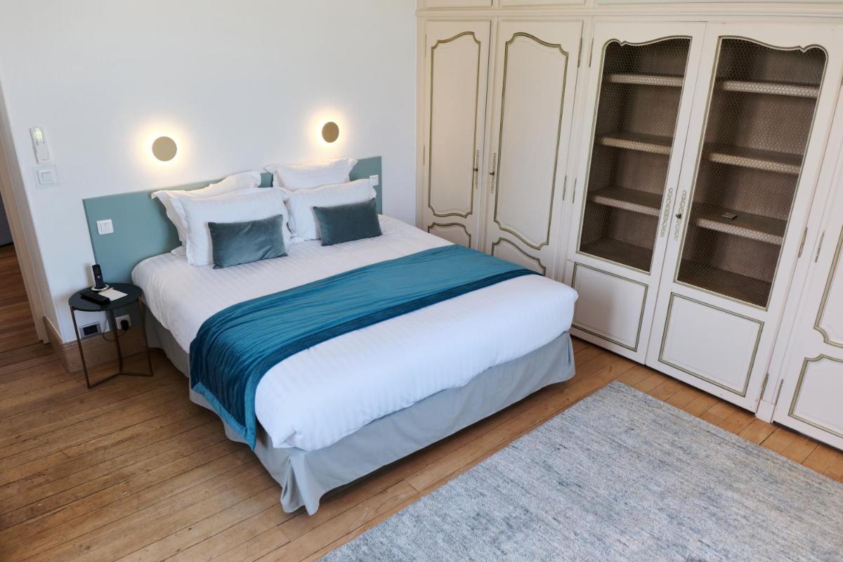 Un ou plusieurs lits dans un hébergement de l'établissement Domaine Du Roncemay - Hôtel, Restaurants, Spa & Golf