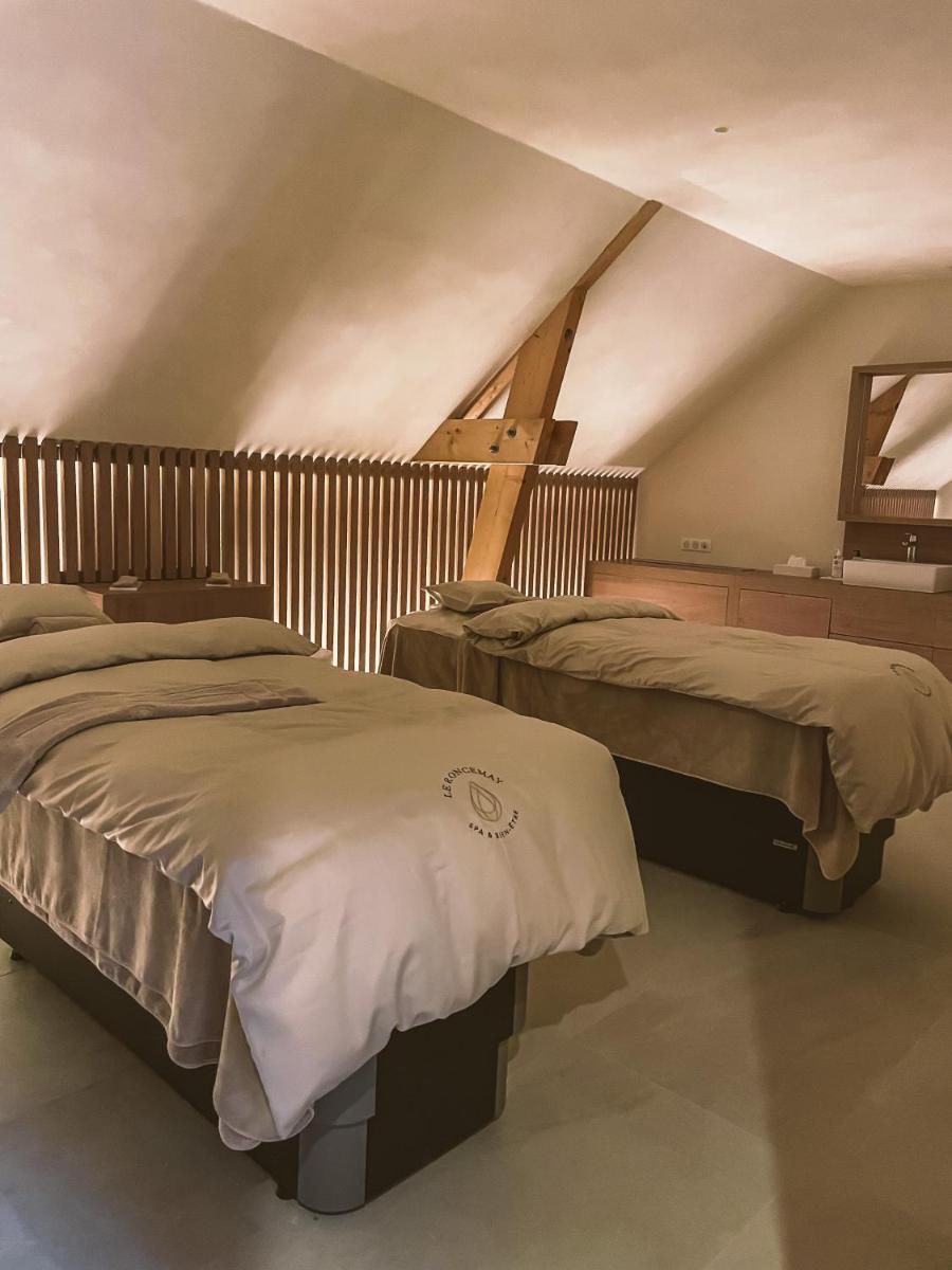 Un ou plusieurs lits dans un hébergement de l'établissement Domaine Du Roncemay - Hôtel, Restaurants, Spa & Golf
