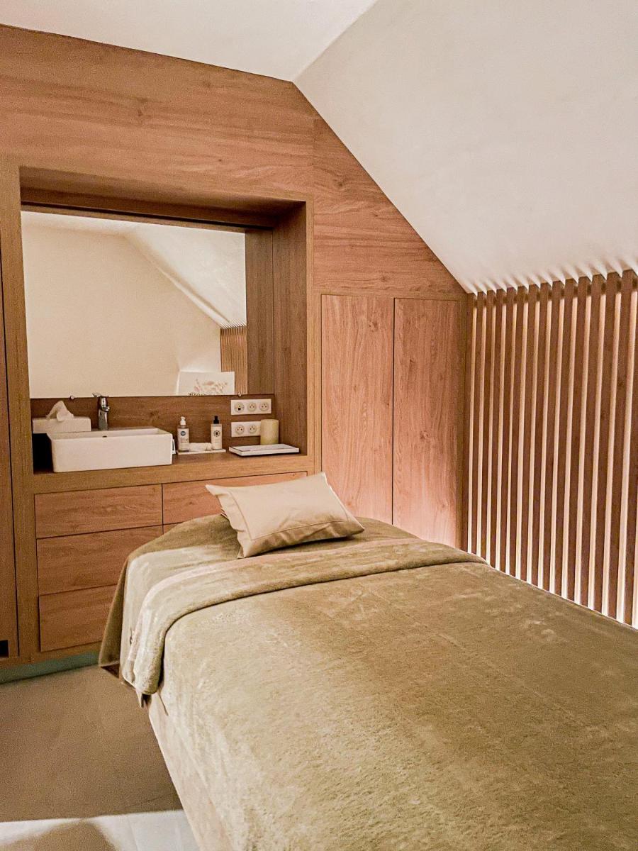 Un ou plusieurs lits dans un hébergement de l'établissement Domaine Du Roncemay - Hôtel, Restaurants, Spa & Golf