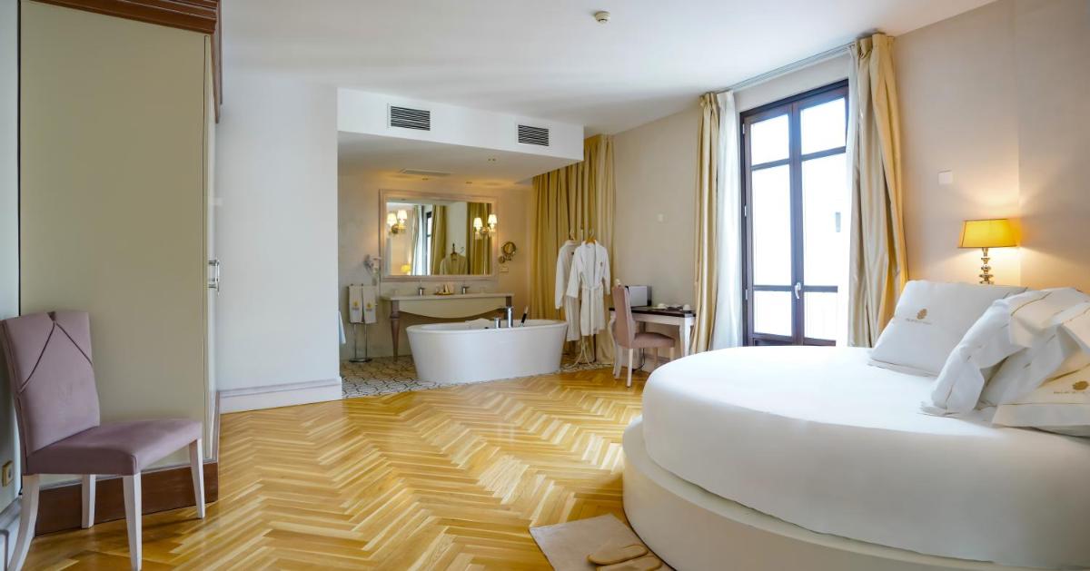 Cama o camas de una habitación en Hotel Palacio De Úbeda 5 G.L