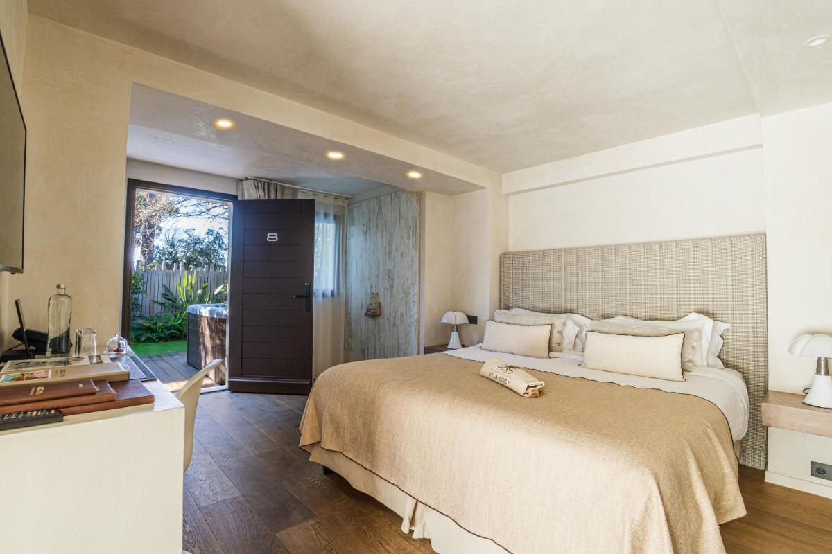 Un ou plusieurs lits dans un hébergement de l'établissement Villa Cosy, hotel & spa