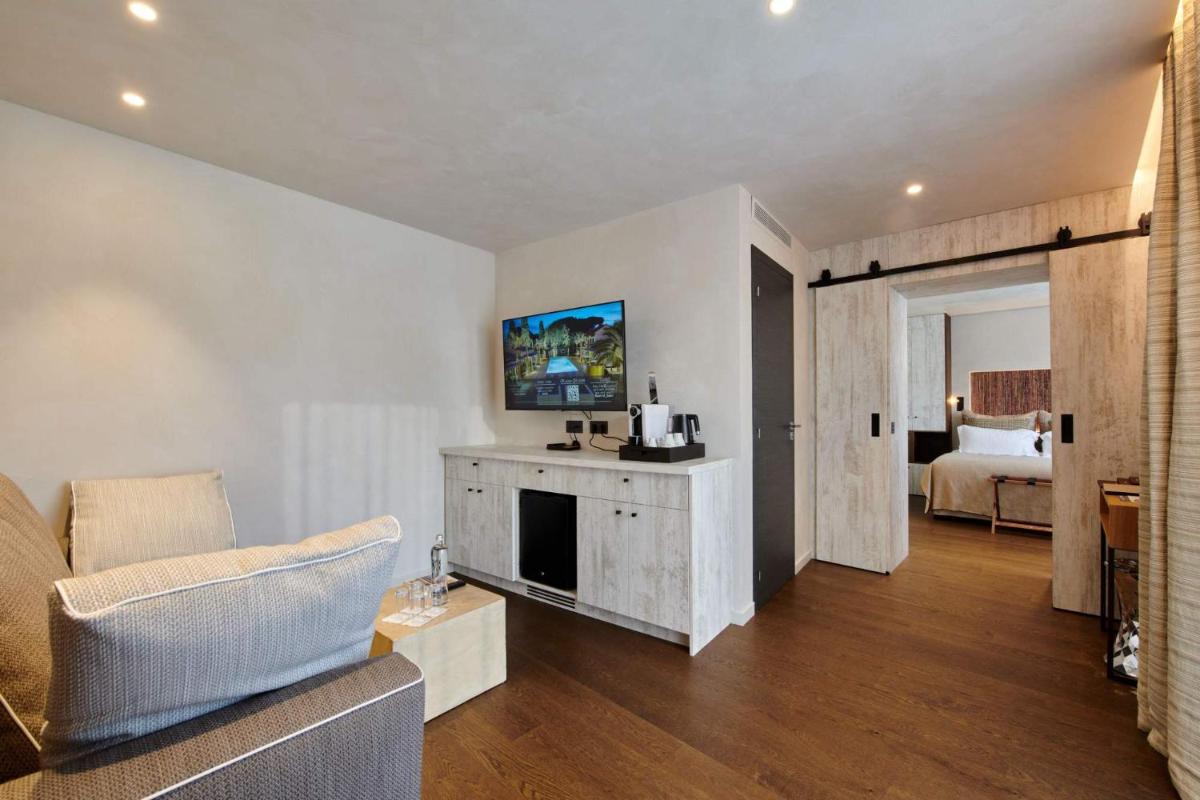 Un ou plusieurs lits dans un hébergement de l'établissement Villa Cosy, hotel & spa
