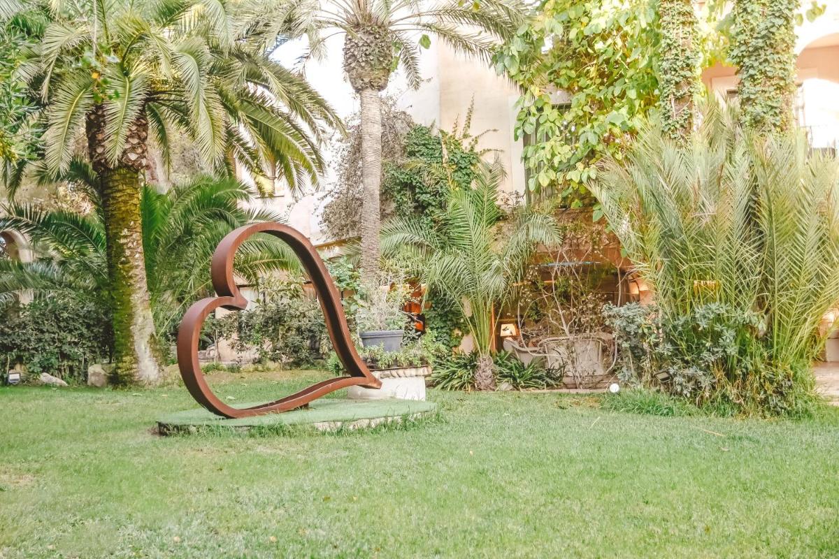 Jardín al aire libre en Lago Garden Apart-Suites & Spa Hotel
