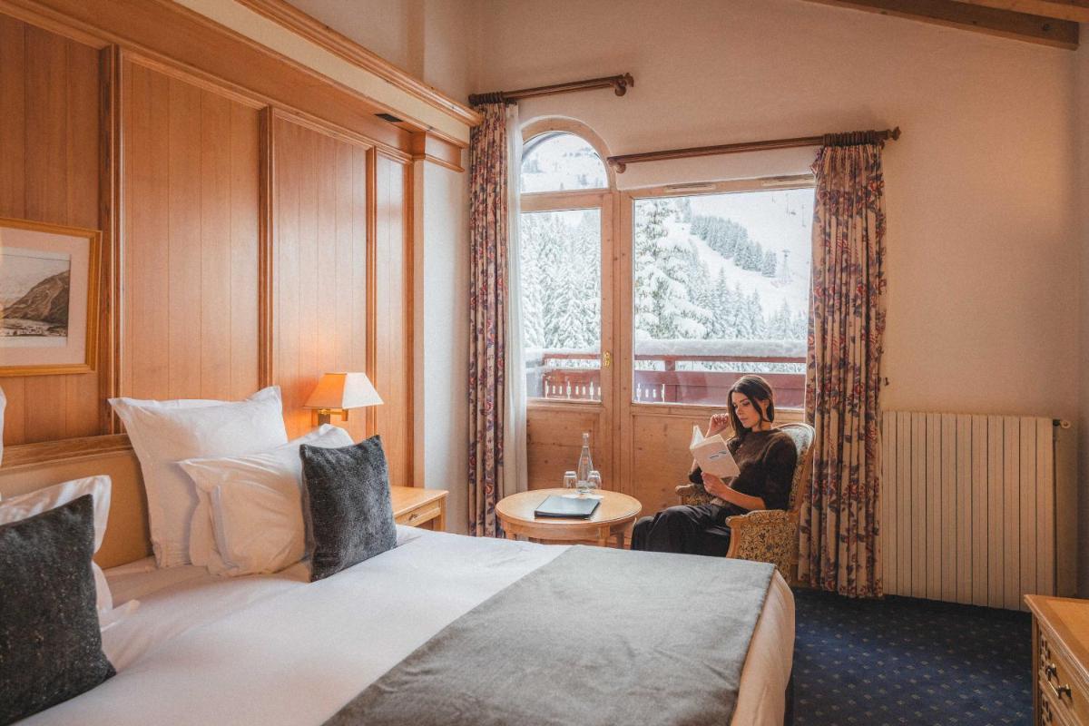 Un ou plusieurs lits dans un hébergement de l'établissement Hotel Carlina