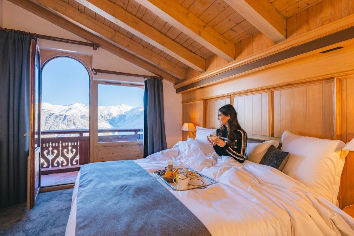 Un ou plusieurs lits dans un hébergement de l'établissement Hotel Carlina