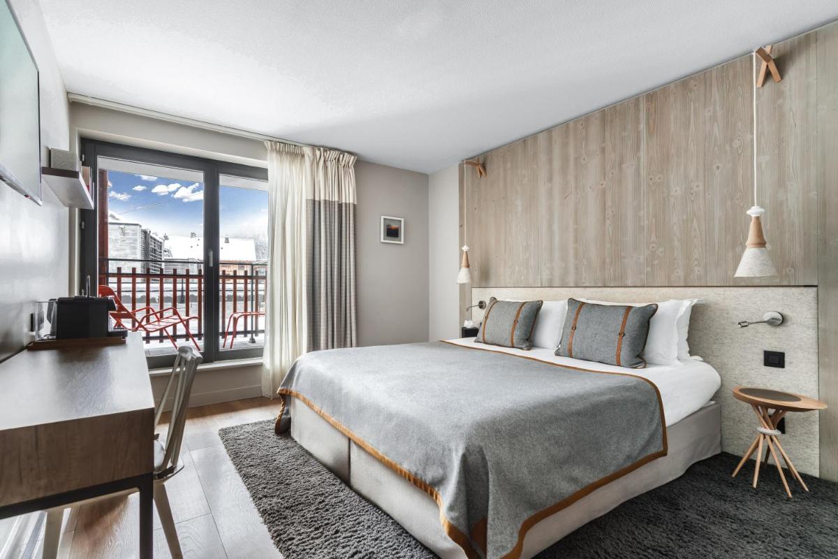 Un ou plusieurs lits dans un hébergement de l'établissement Heliopic Hotel & Spa