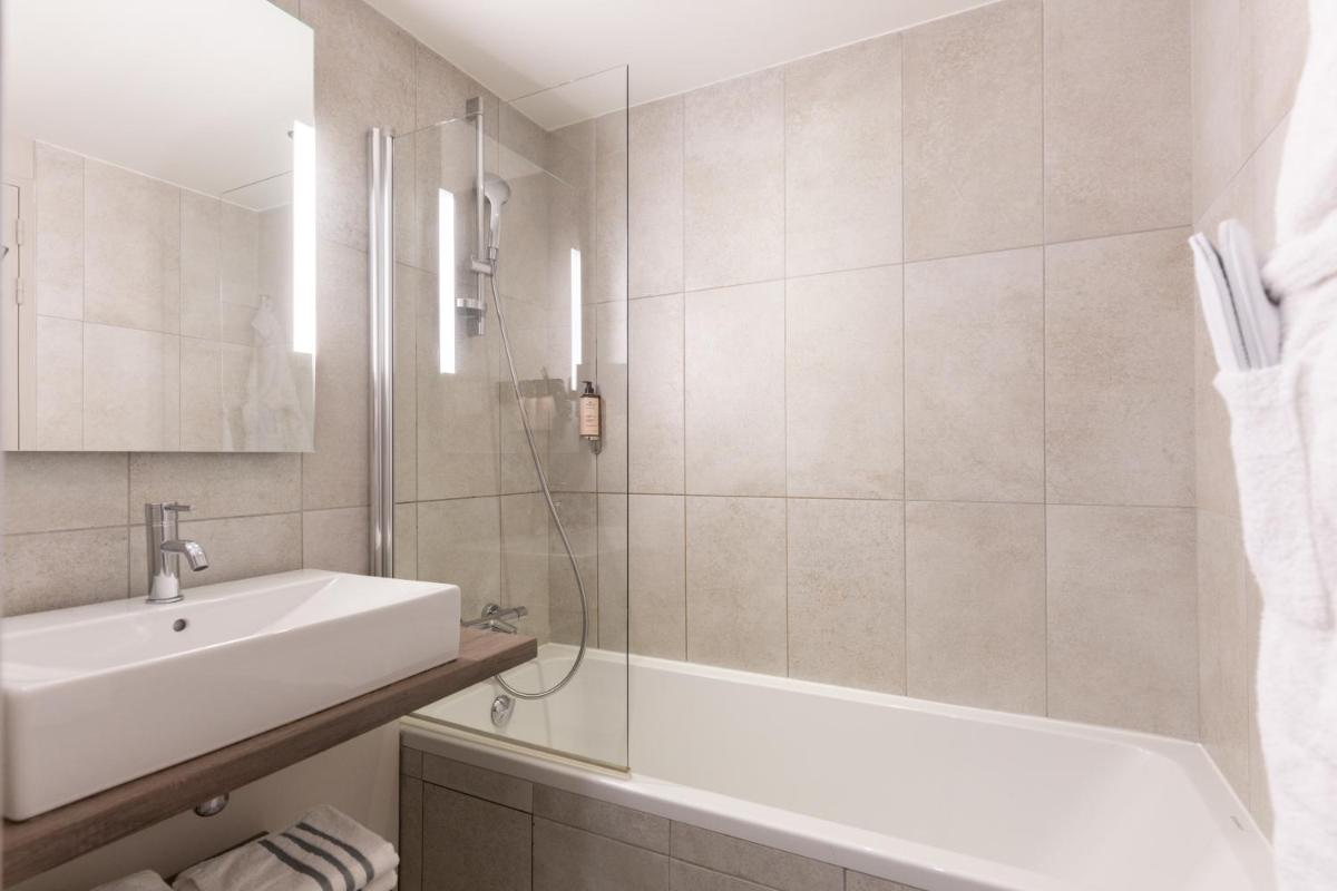 Salle de bains dans l'établissement Heliopic Hotel & Spa