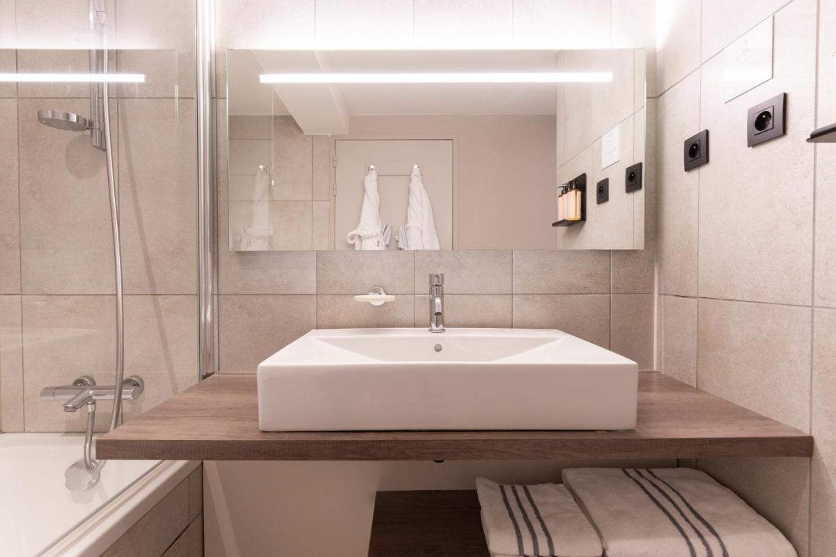 Salle de bains dans l'établissement Heliopic Hotel & Spa