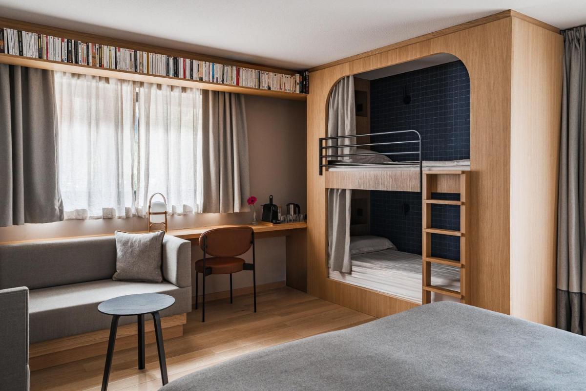 Un ou plusieurs lits dans un hébergement de l'établissement Heliopic Hotel & Spa