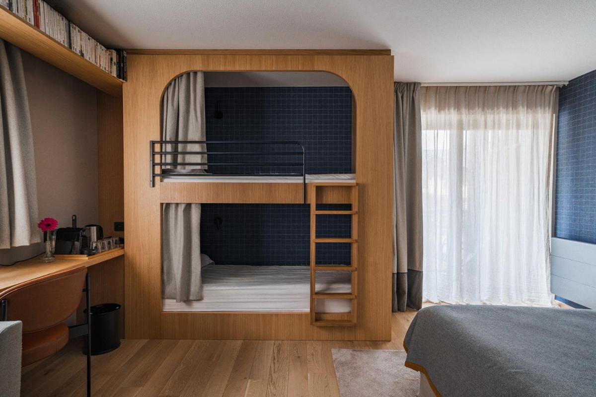 Un ou plusieurs lits dans un hébergement de l'établissement Heliopic Hotel & Spa