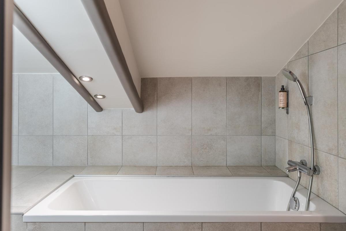 Salle de bains dans l'établissement Heliopic Hotel & Spa