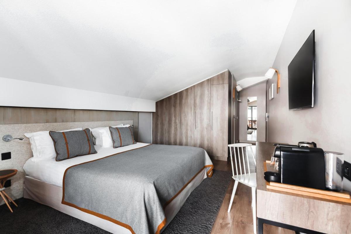Un ou plusieurs lits dans un hébergement de l'établissement Heliopic Hotel & Spa