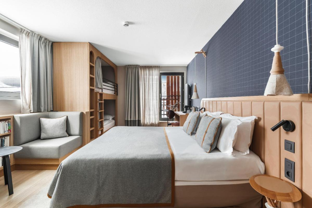 Un ou plusieurs lits dans un hébergement de l'établissement Heliopic Hotel & Spa