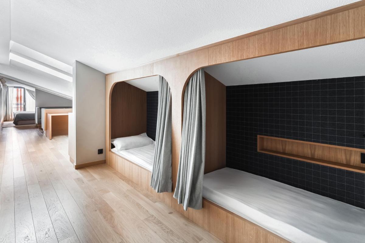 Un ou plusieurs lits dans un hébergement de l'établissement Heliopic Hotel & Spa