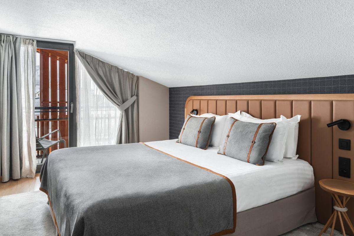 Un ou plusieurs lits dans un hébergement de l'établissement Heliopic Hotel & Spa