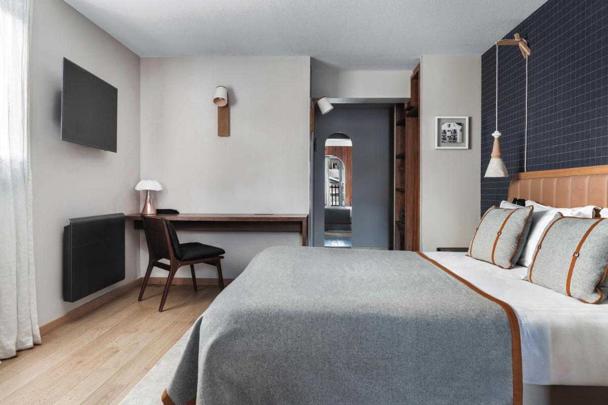 Un ou plusieurs lits dans un hébergement de l'établissement Heliopic Hotel & Spa