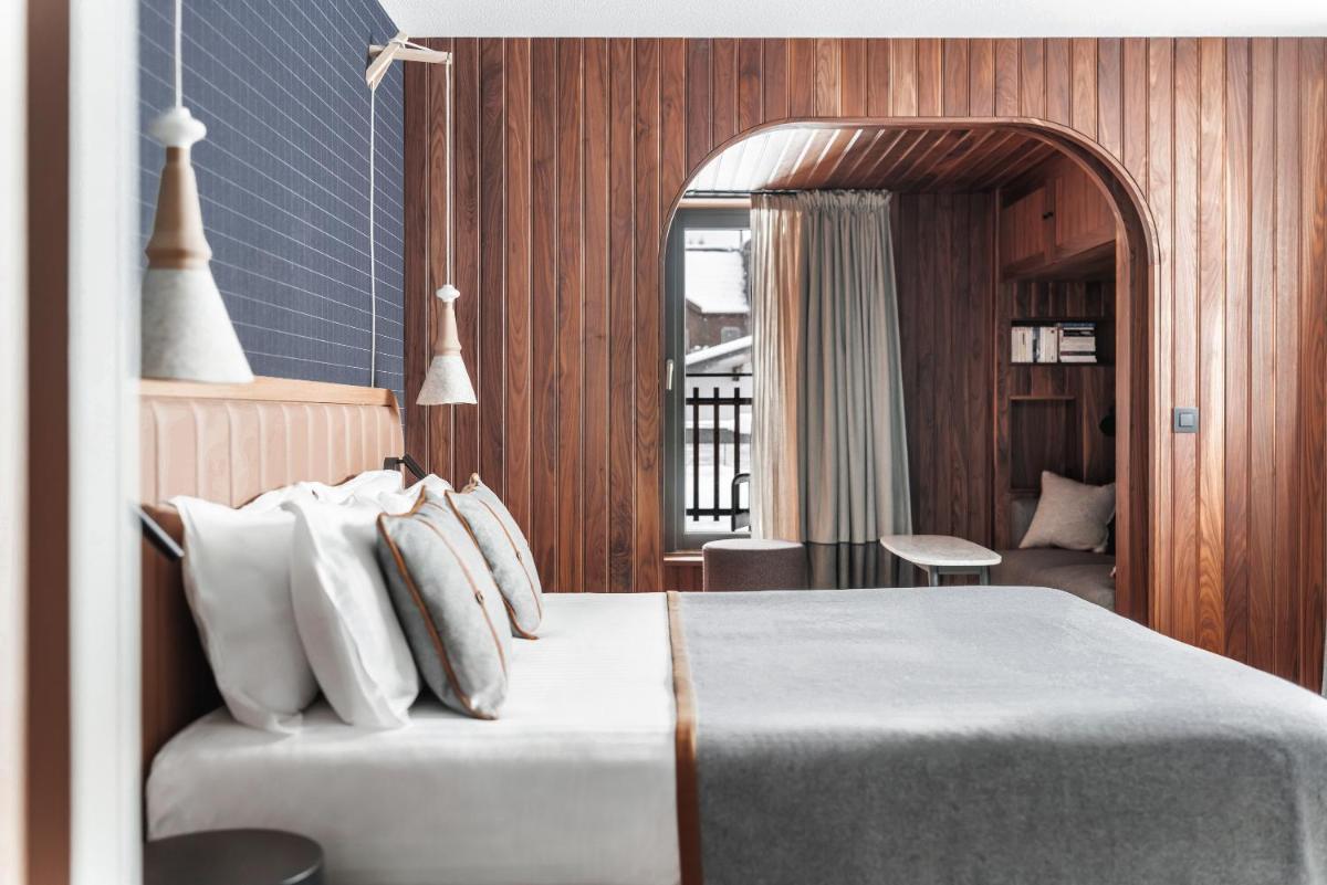 Un ou plusieurs lits dans un hébergement de l'établissement Heliopic Hotel & Spa