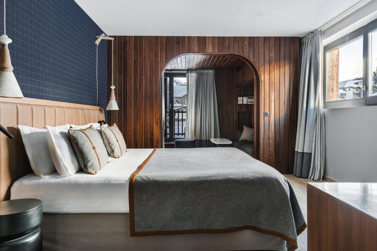 Un ou plusieurs lits dans un hébergement de l'établissement Heliopic Hotel & Spa