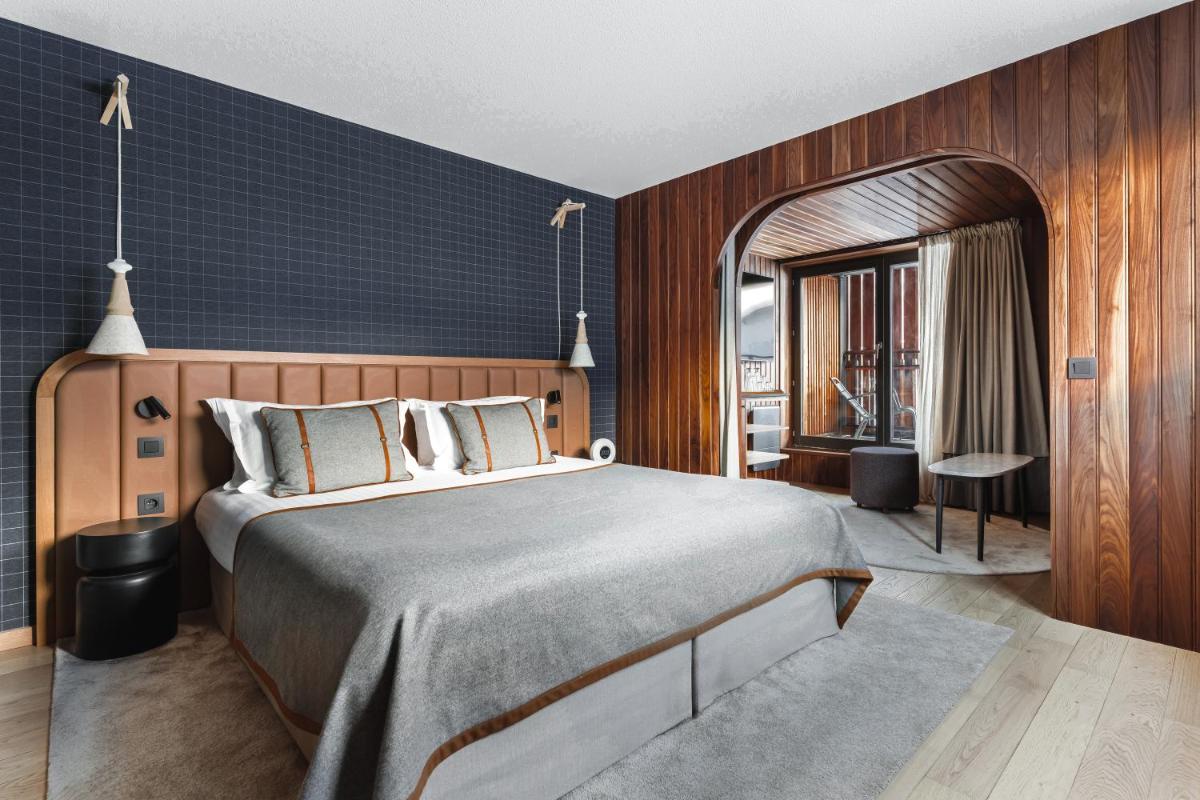Un ou plusieurs lits dans un hébergement de l'établissement Heliopic Hotel & Spa