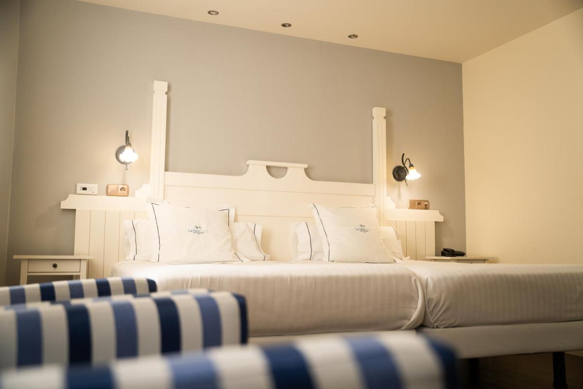 Cama o camas de una habitación en Hotel Balneario La Hermida