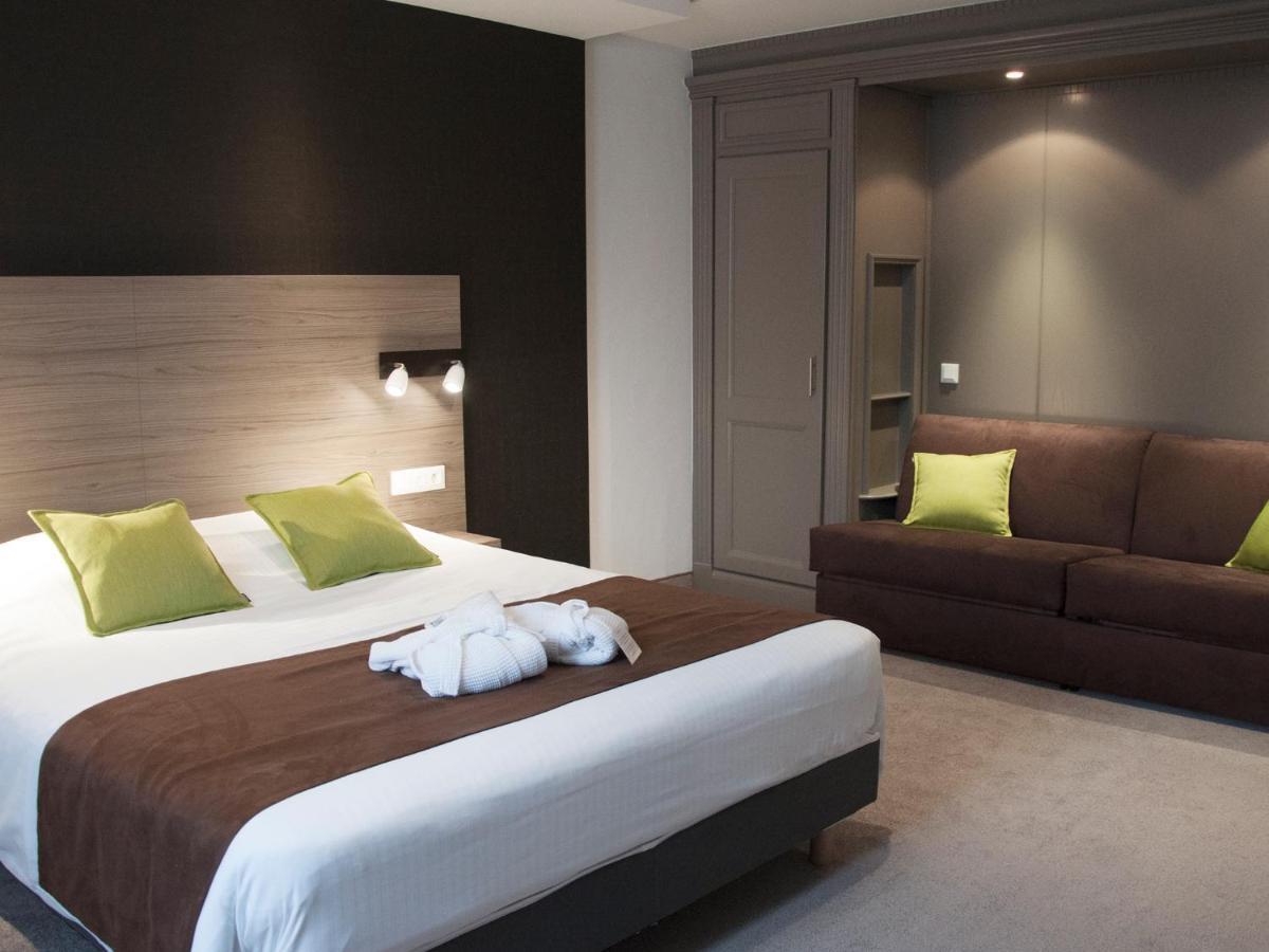 Un ou plusieurs lits dans un hébergement de l'établissement Hotel Restaurant & Spa Verte Vallée