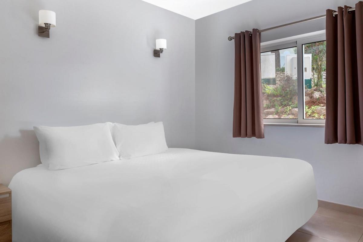Uma cama ou camas num quarto em Vilar do Golf