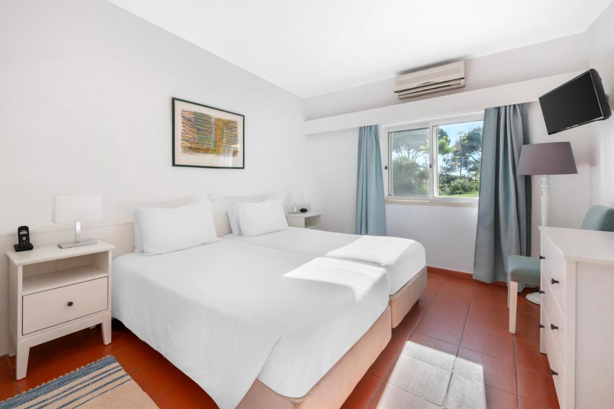 Uma cama ou camas num quarto em Vilar do Golf