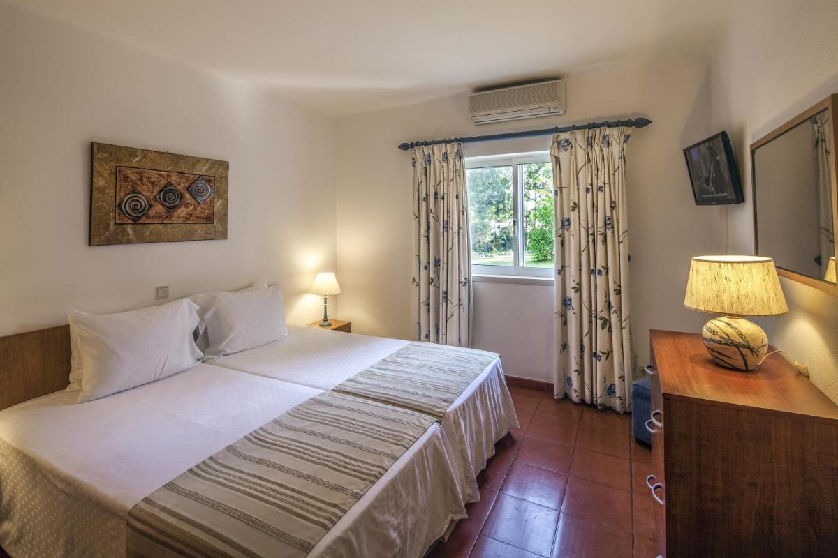 Uma cama ou camas num quarto em Vilar do Golf