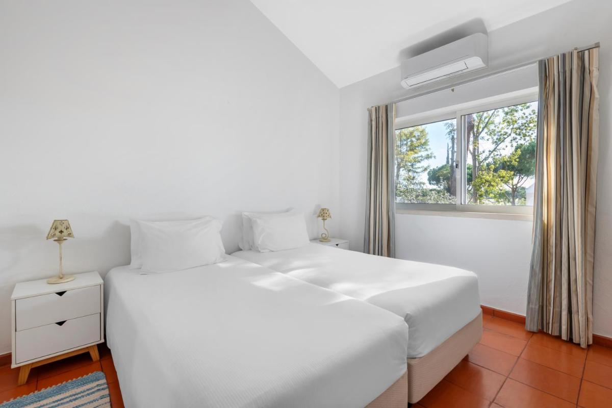 Uma cama ou camas num quarto em Vilar do Golf
