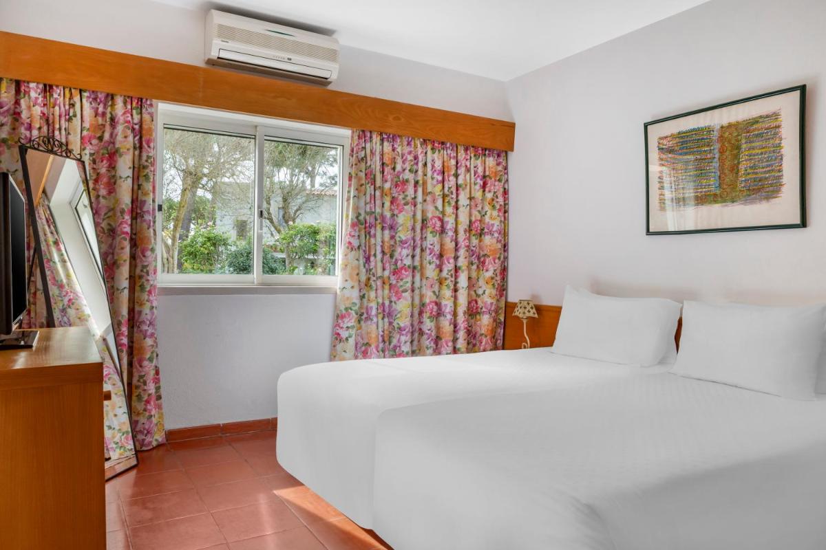 Uma cama ou camas num quarto em Vilar do Golf