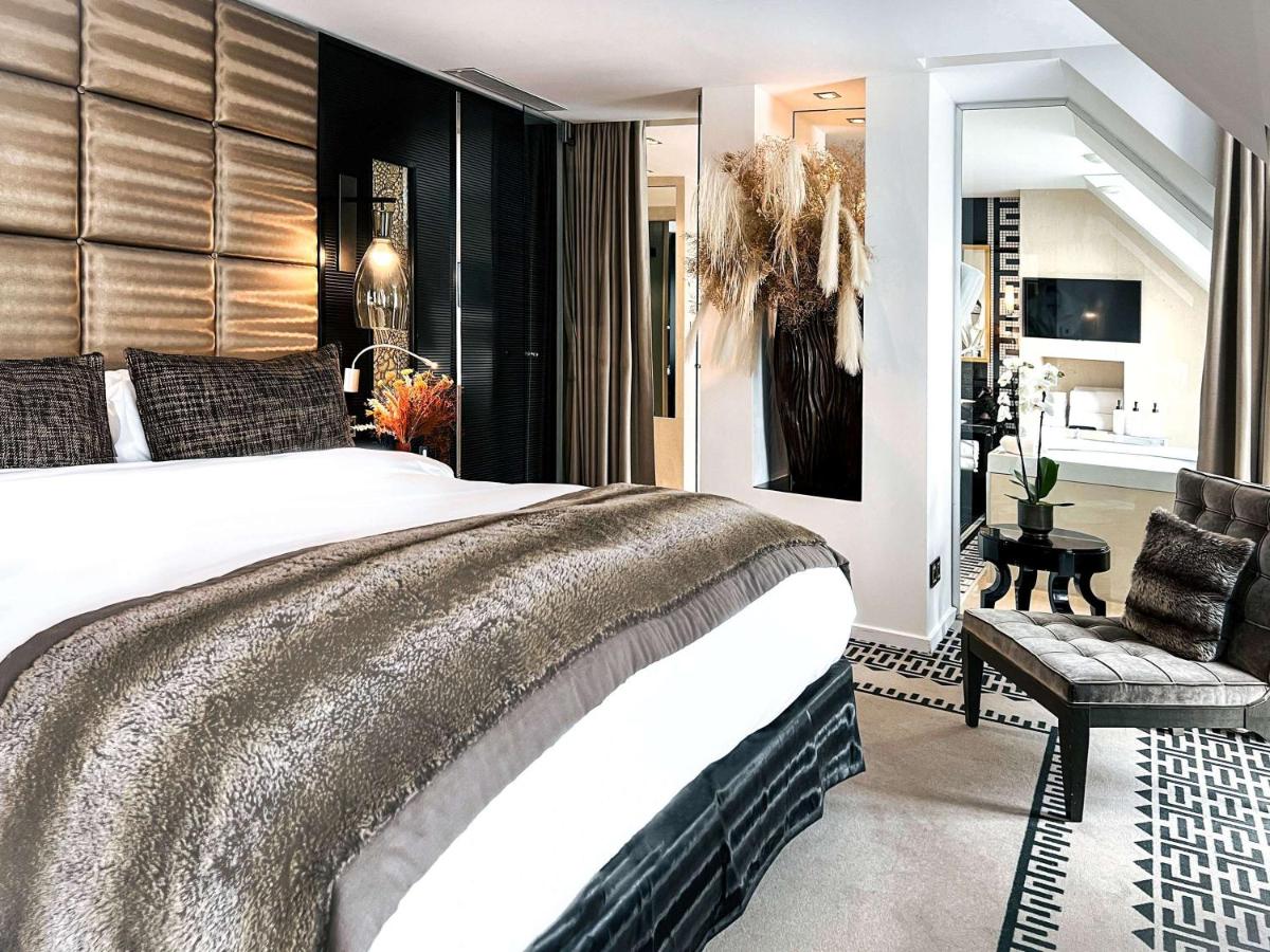 Un ou plusieurs lits dans un hébergement de l'établissement Sofitel Paris Le Faubourg