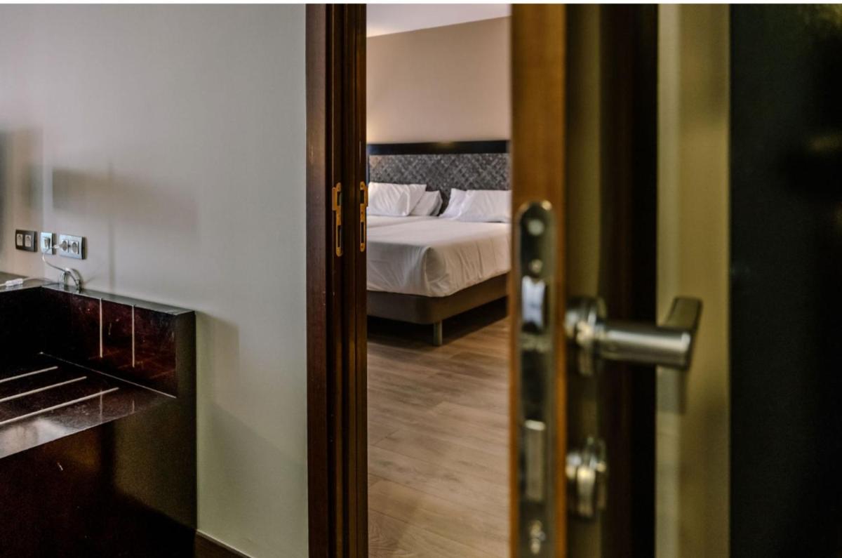 Cama o camas de una habitación en HG Alto Aragón