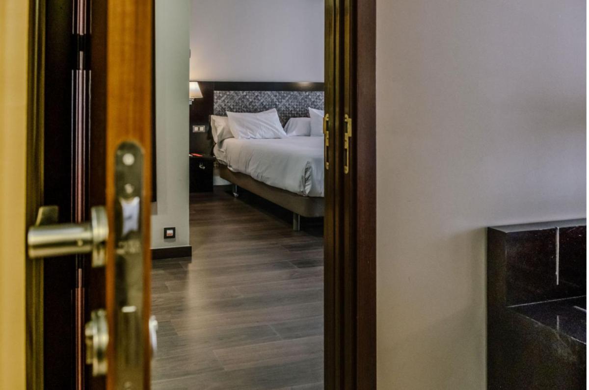 Cama o camas de una habitación en HG Alto Aragón