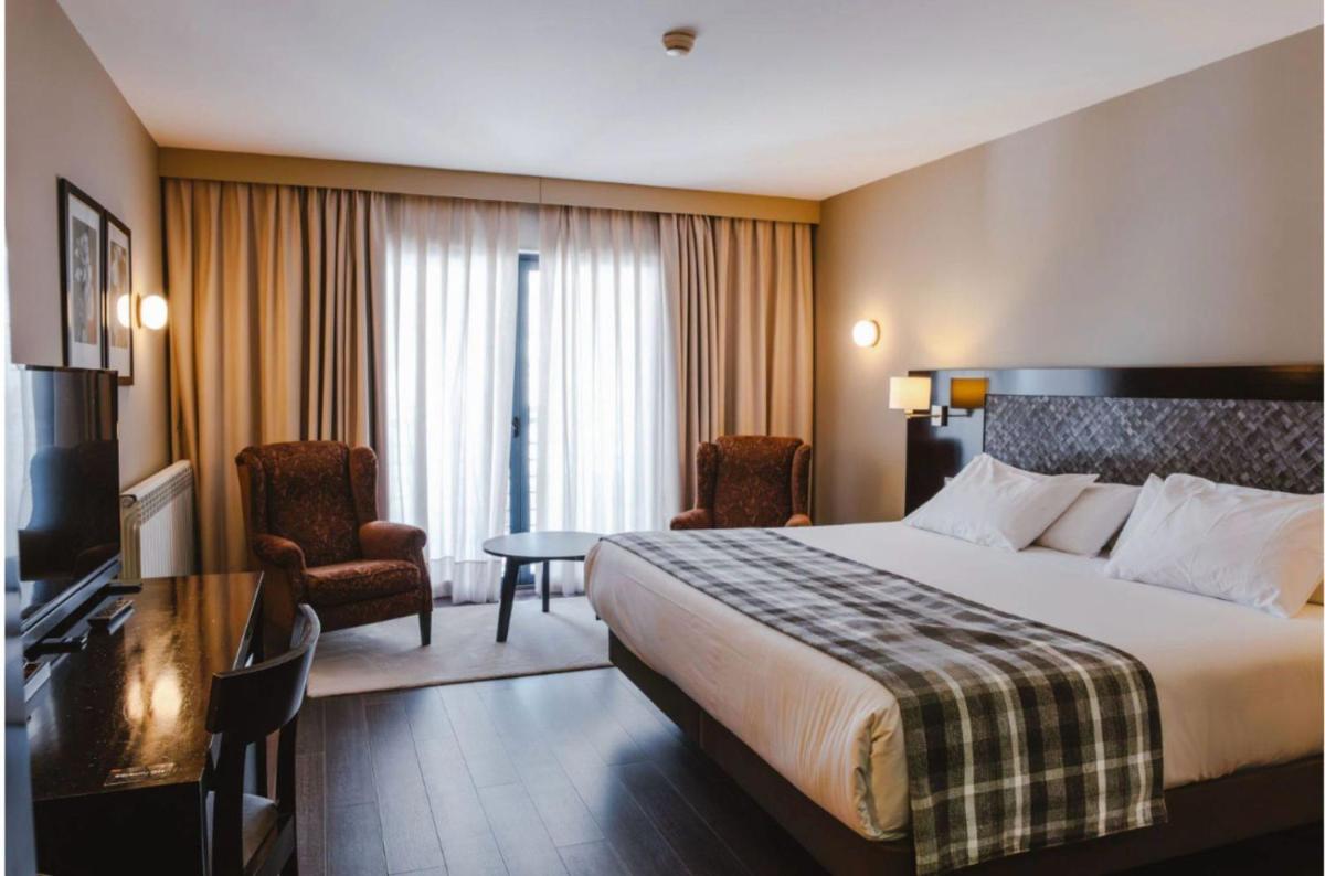 Cama o camas de una habitación en HG Alto Aragón