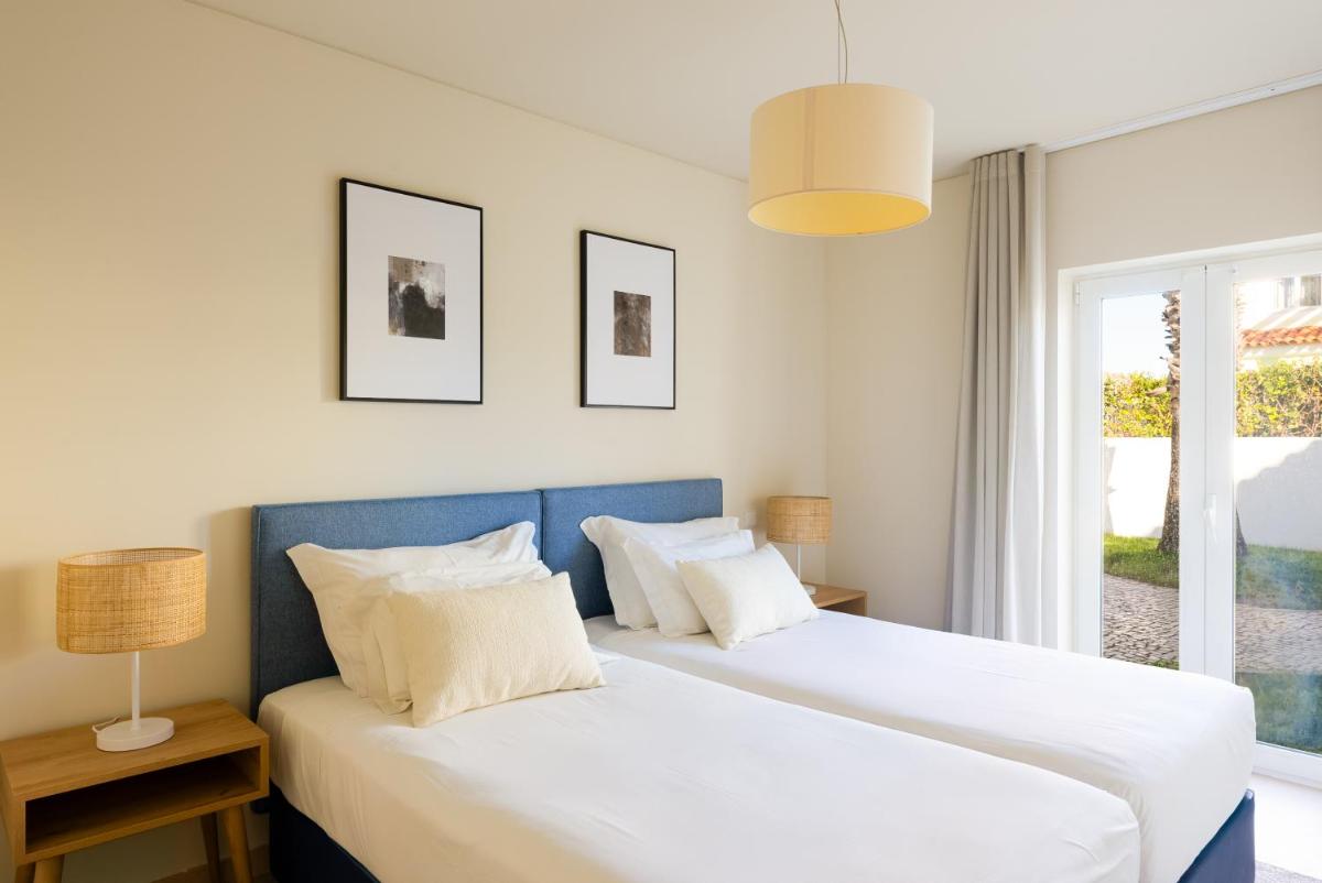 Uma cama ou camas num quarto em Eden Villas & Apartments