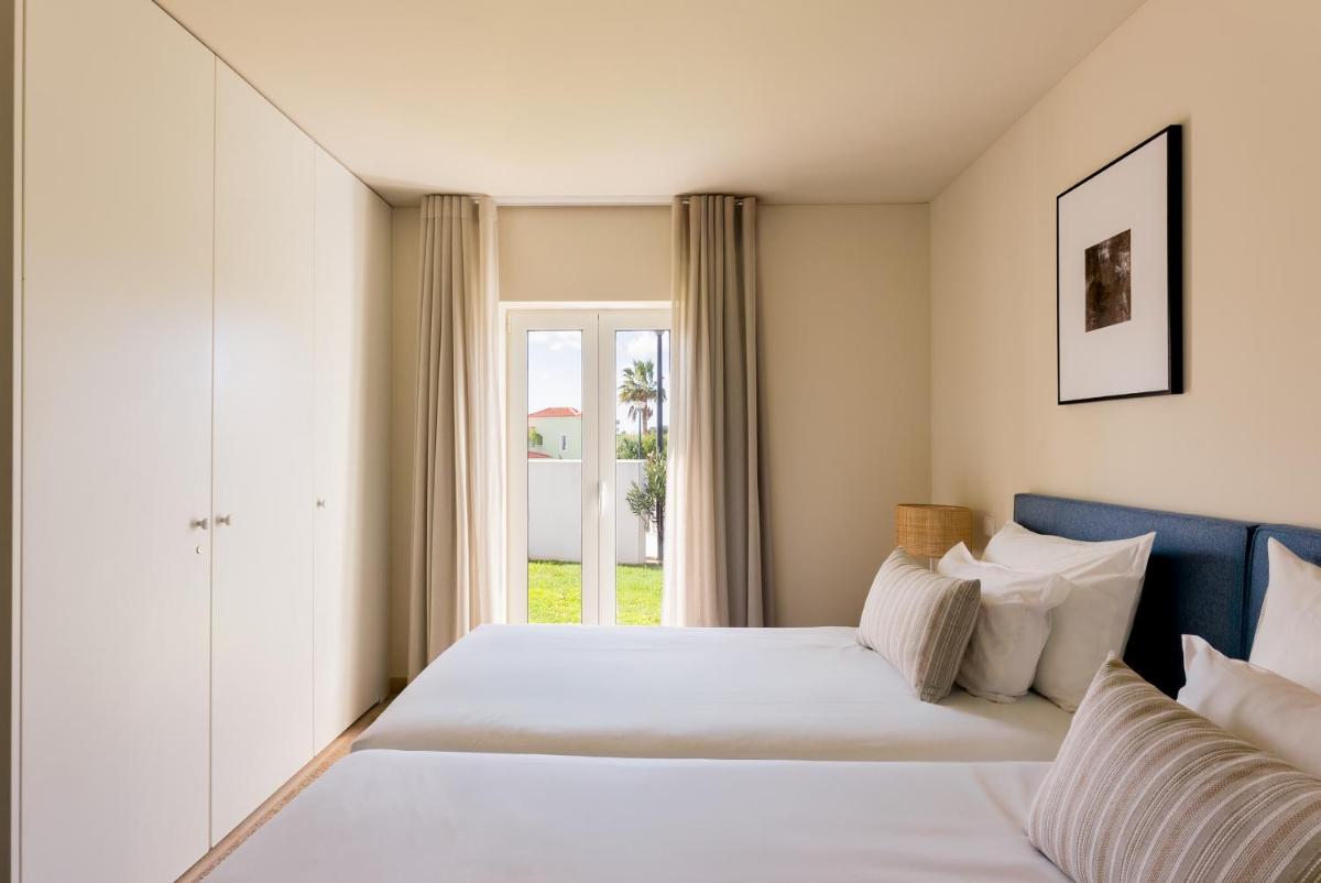 Uma cama ou camas num quarto em Eden Villas & Apartments