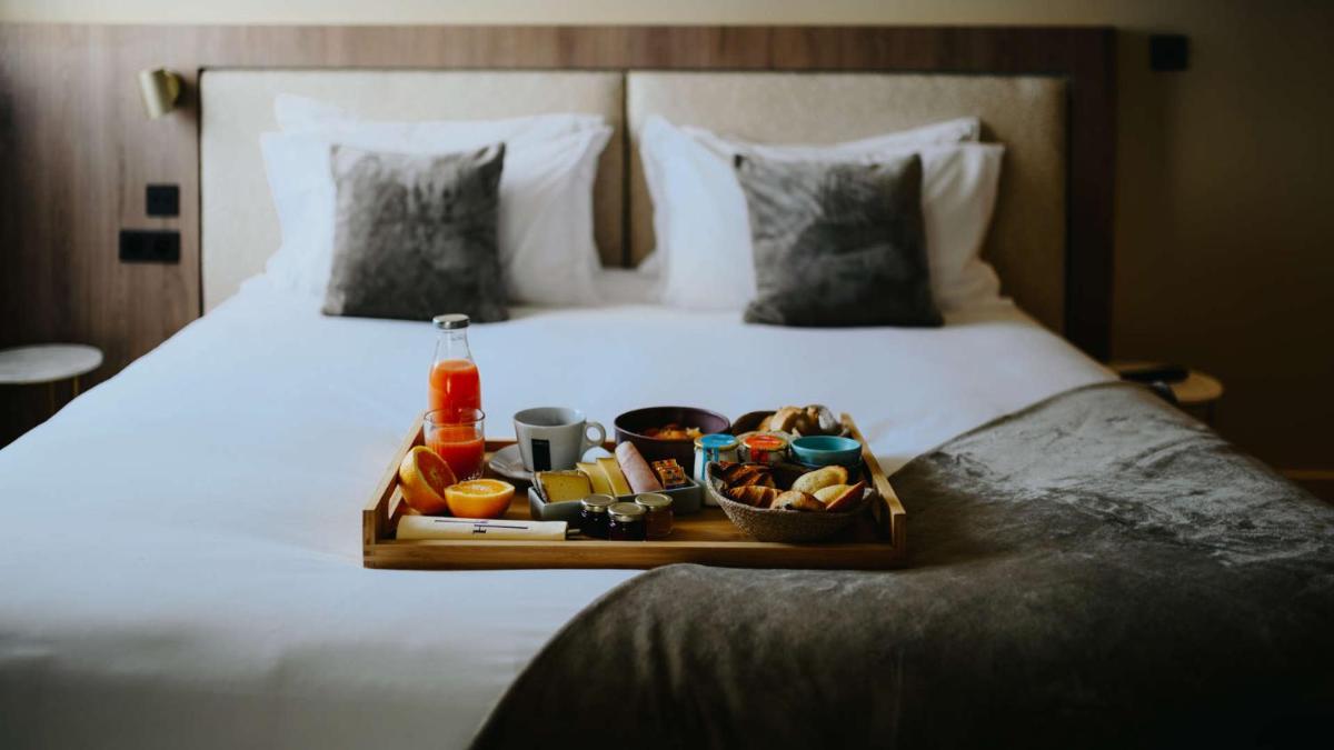 Un ou plusieurs lits dans un hébergement de l'établissement Keystone Hôtel & Spa
