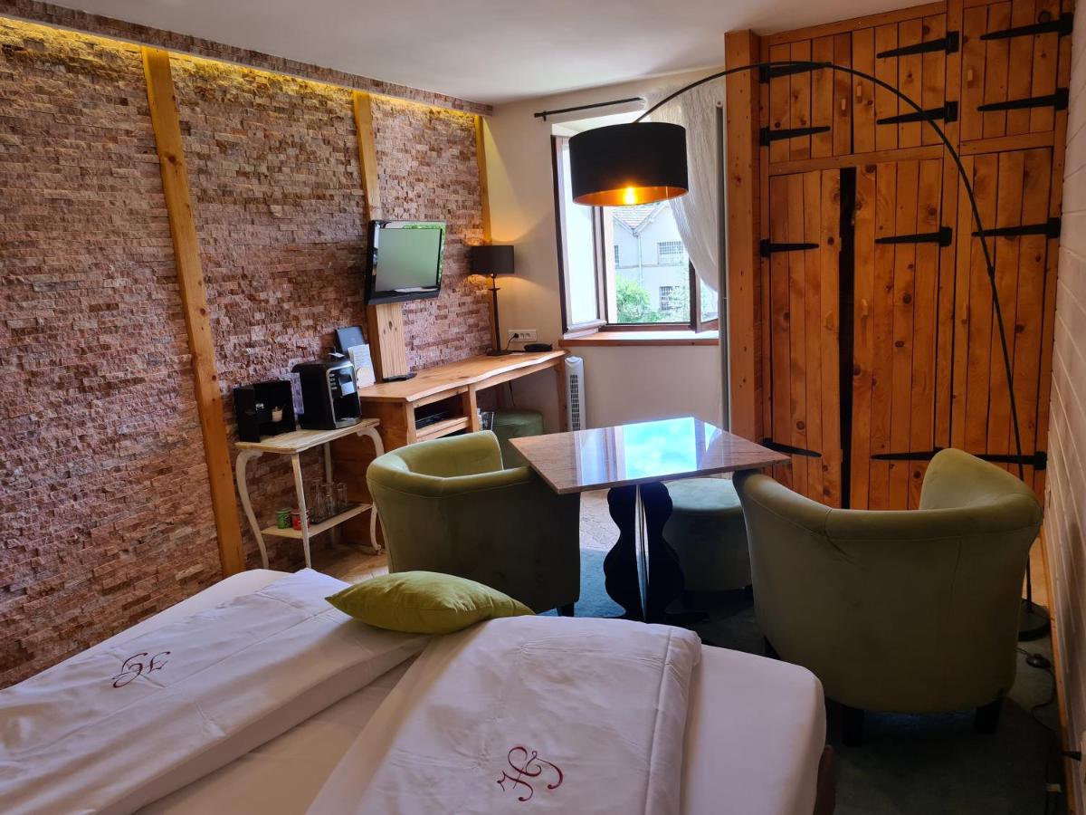 Un ou plusieurs lits dans un hébergement de l'établissement Domaine du Haut Jardin Hôtel & Chalets Spa Privé