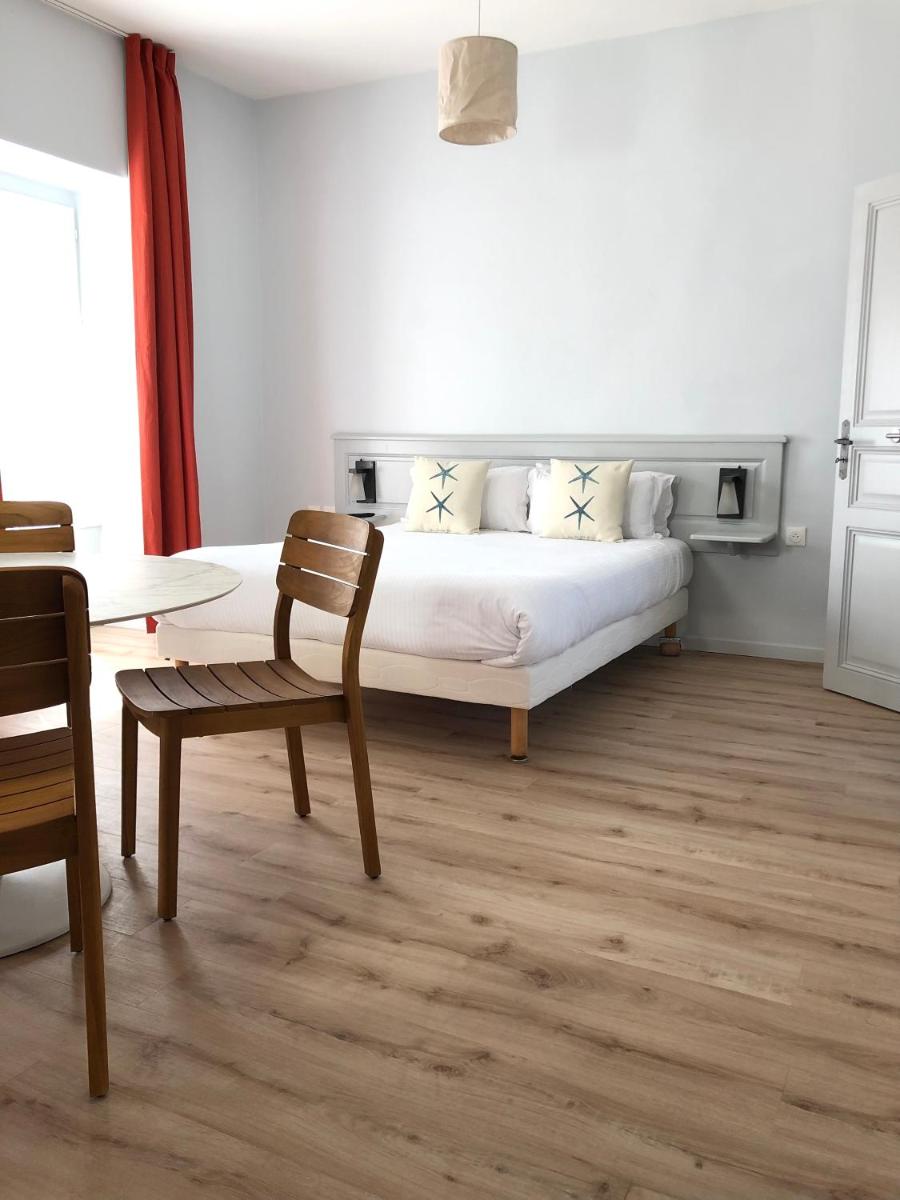 Un ou plusieurs lits dans un hébergement de l'établissement Eco-Domaine La Fontaine - RESIDENCE-SPA - Plage de la Fontaine aux Bretons