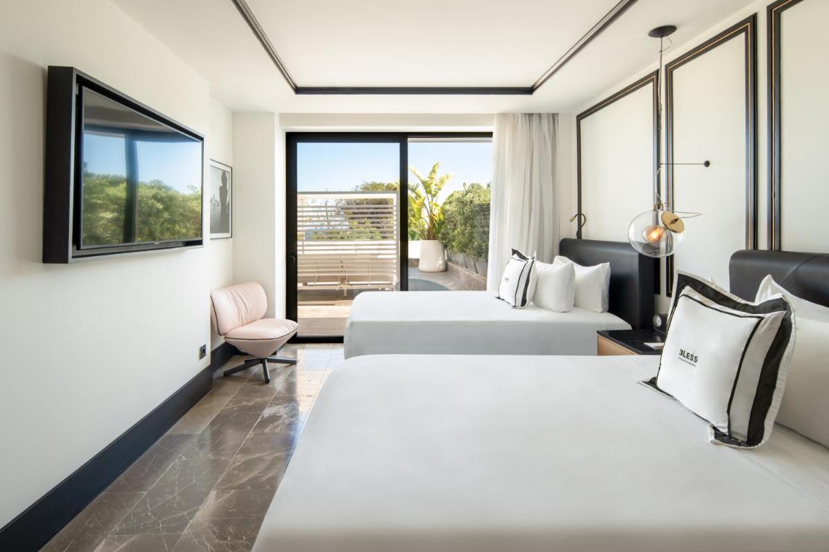 Cama o camas de una habitación en BLESS Hotel Ibiza - The Leading Hotels of The World