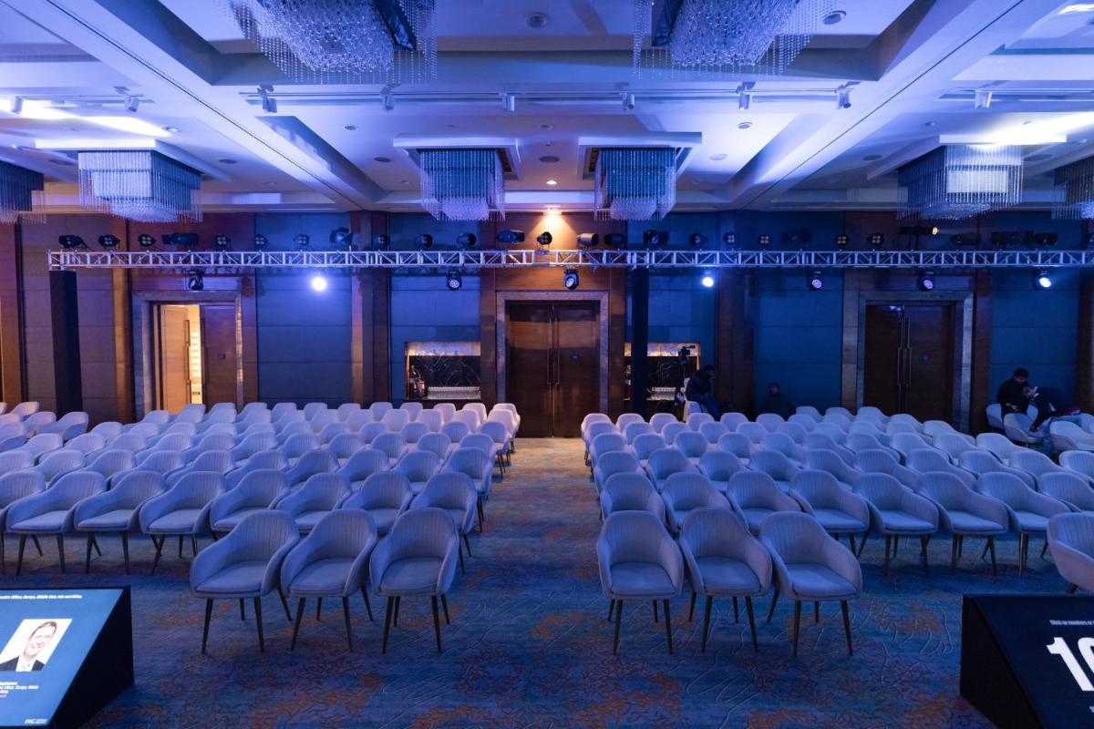 a room with rows of chairs in a hall at Crowne Plaza Today Gurugram by IHG in Gurgaon