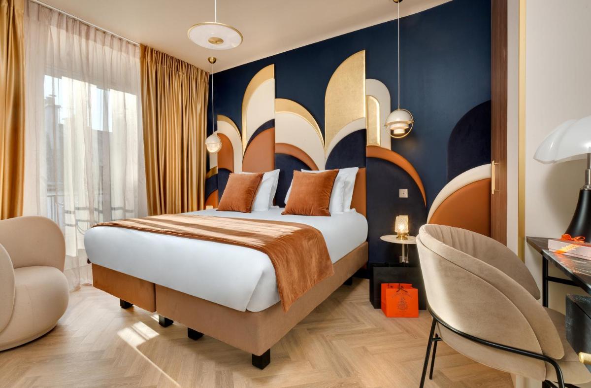 Un ou plusieurs lits dans un hébergement de l'établissement Hôtel Artemisia Montmartre