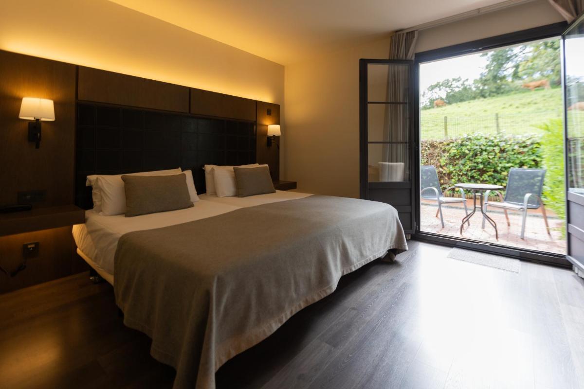 Cama o camas de una habitación en La Piconera Hotel & Spa