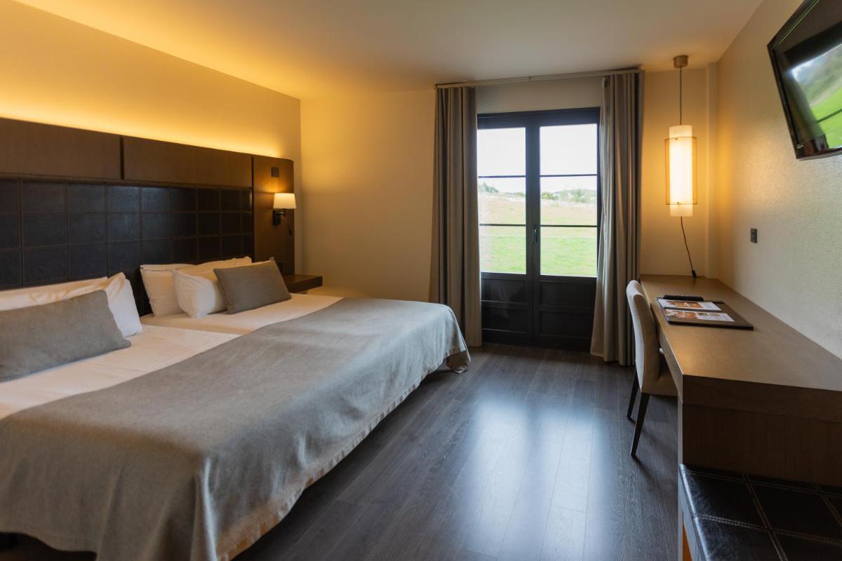 Cama o camas de una habitación en La Piconera Hotel & Spa