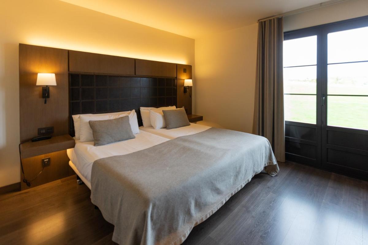 Cama o camas de una habitación en La Piconera Hotel & Spa