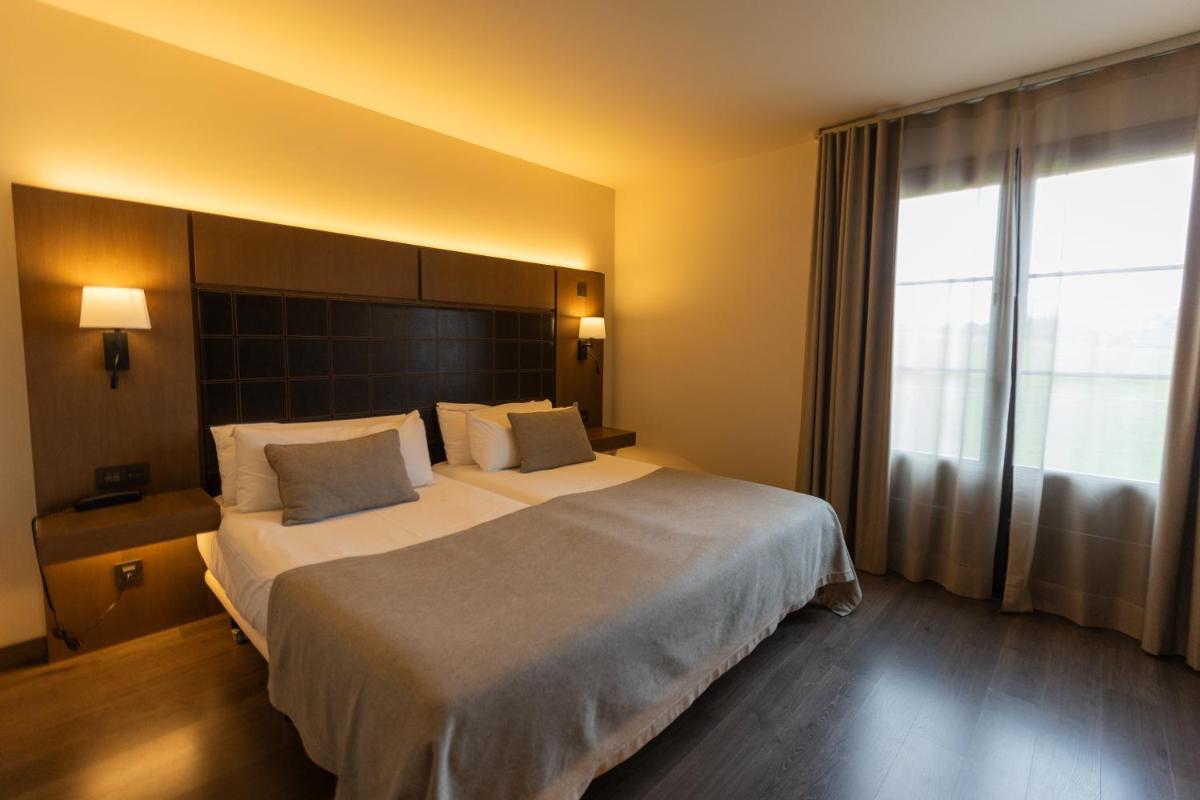 Cama o camas de una habitación en La Piconera Hotel & Spa