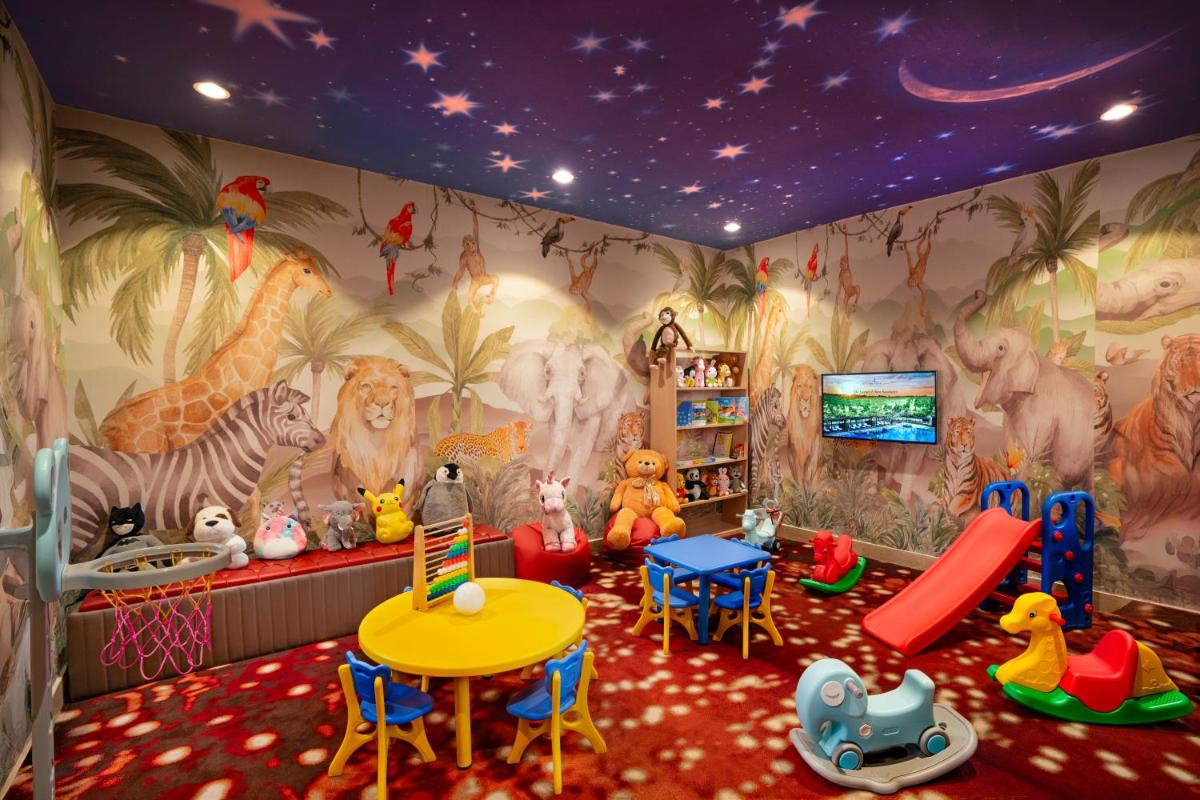 a childrens play room with animals on the wall at The Leela Ambience Gurugram Hotel & Residences - The Luxury Urban Sanctuary in Gurgaon