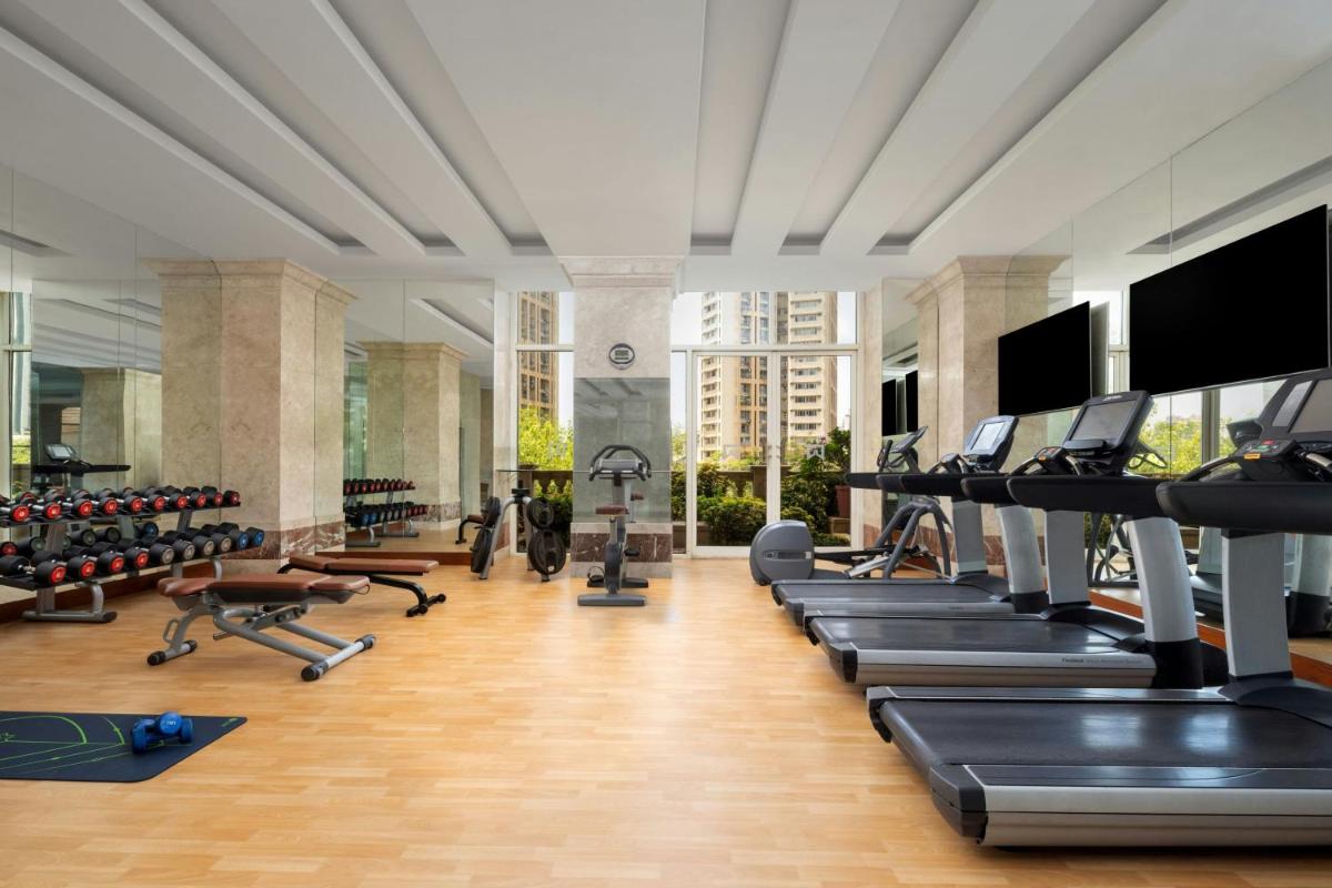 a gym with treadmills and exercise equipment in a building at ITC Grand Central, a Luxury Collection Hotel, Mumbai in Mumbai