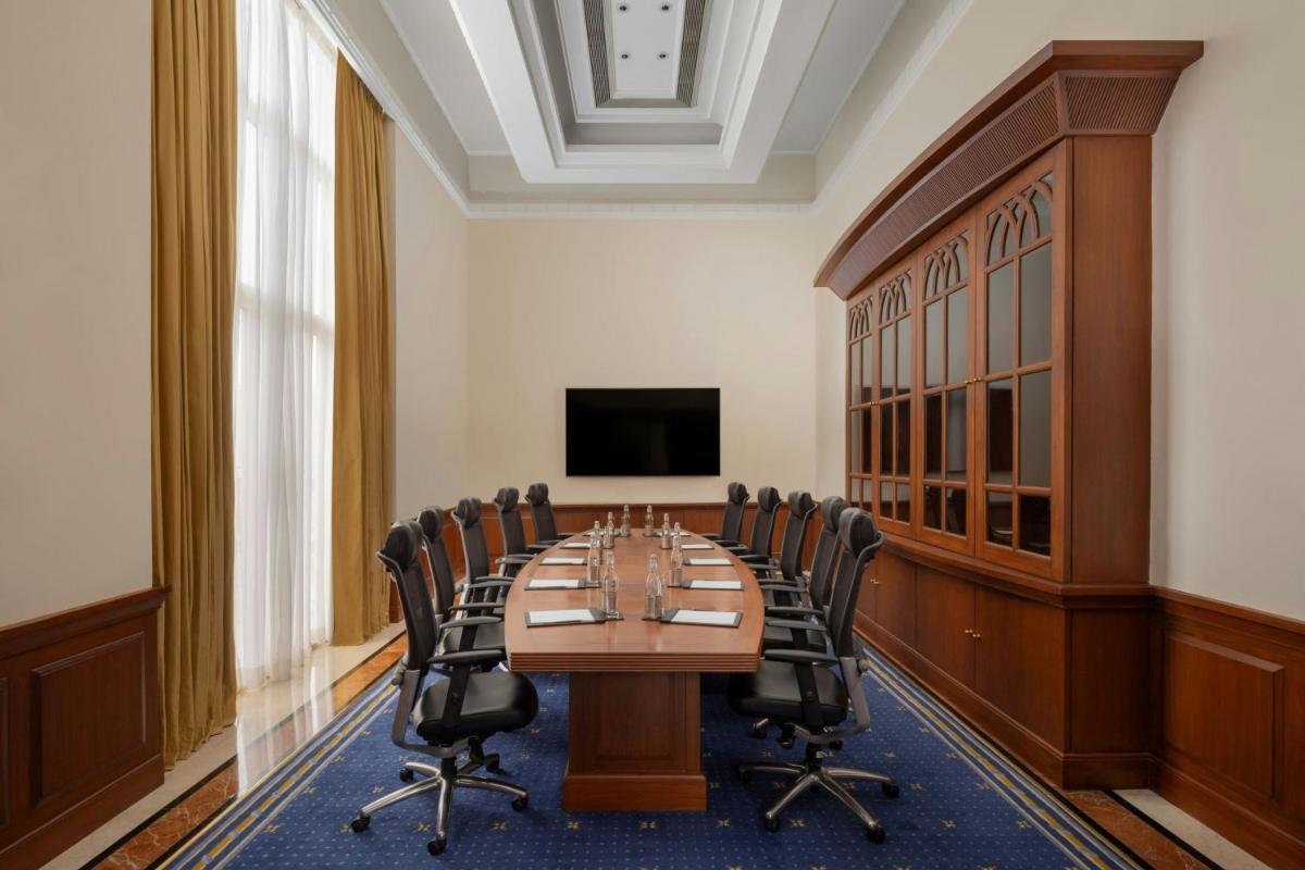 a conference room with a long table and chairs at ITC Grand Central, a Luxury Collection Hotel, Mumbai in Mumbai